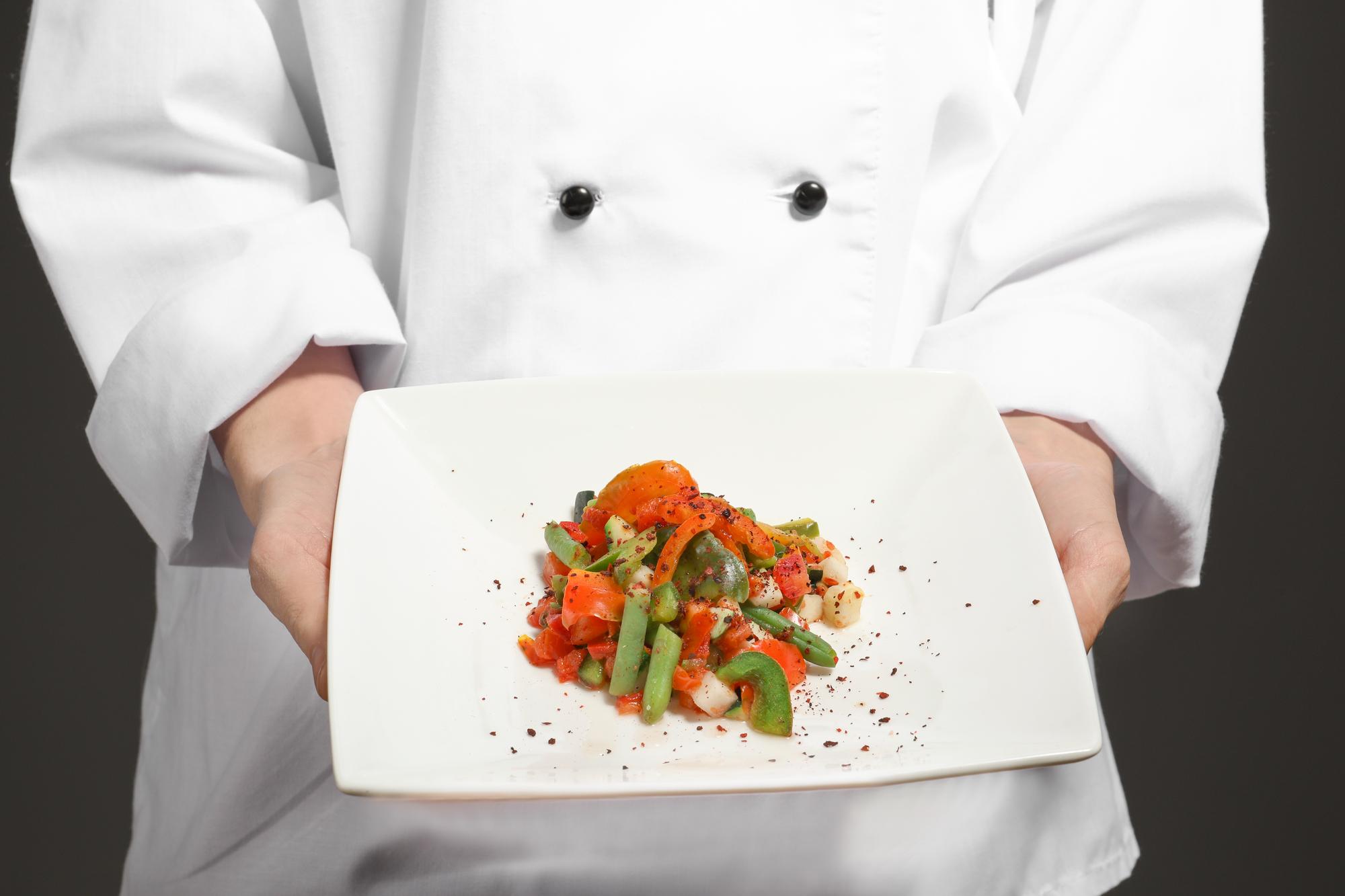 Artisan chef preparing plated dish